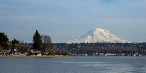 Mount Rainier as seen from south Puget Sound with Gig Harbor's Magnolia Heights waterfront houses in the foreground.