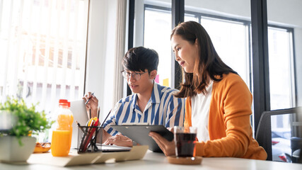 Business team workers discussing work and prepare pizza and potato chips to sharing meal at lunch break for good relations in office.