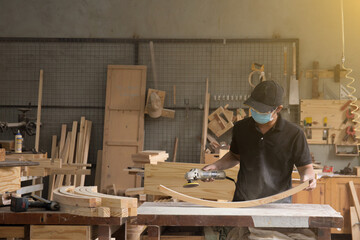 Sanding machine, The carpenter uses a polishing machine to smooth the wood.