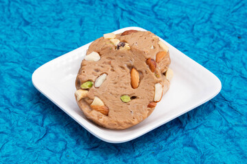 Gheewala Sohan Halwa Patti Mithai Originating From Punjab Multan Karachi Ajmer And Old Delhi India Is Made Of Pure Desi Ghee Doodh Cornflour Maida And Meetha Sugar. Blue Background With Copy Space