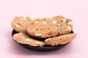 Gheewala Sohan Halwa Patti Mithai Originating From Punjab Multan Karachi Ajmer And Old Delhi India Is Made Of Pure Desi Ghee Doodh Cornflour Maida And Meetha Sugar. Pink Background With Copy Space
