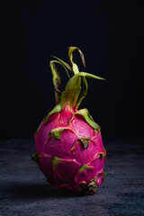Dragon fruit or pitahaya on a dark background.