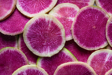 Slices of watermelon radish. Food background.