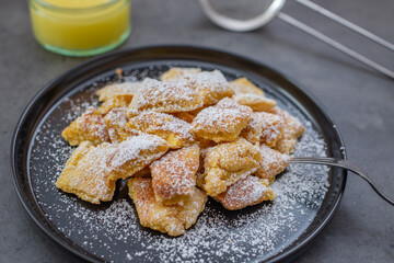 Austrian cuisine. Torn pancake (or omelet) kaiserschmarrn with honey, powdered sugar