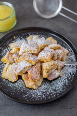 Austrian cuisine. Torn pancake (or omelet) kaiserschmarrn with honey, powdered sugar