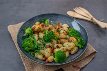 healthy home made roasted italian gnocchi with bacon and broccoli