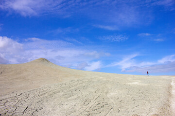 A man photographing a beautiful mud volcano. Alat. Azerbaijan.