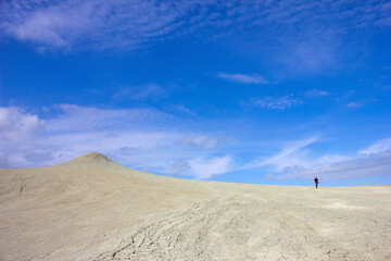 A man photographing a beautiful mud volcano. Alat. Azerbaijan.