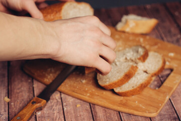 sliced fresh loaf on a wooden cutting board kitchen meal