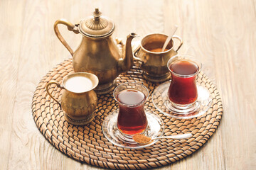 Composition with hot Turkish tea on wooden background