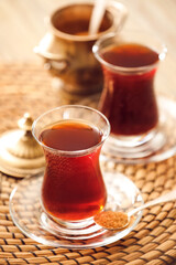 Cups with hot Turkish tea on table, closeup