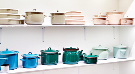 Metal enamel pots and teapots in store
