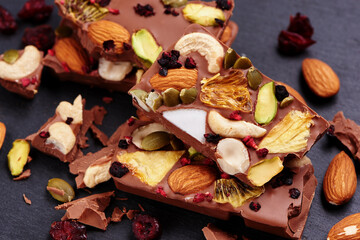 Handmade milk chocolate with dried fruits and nuts