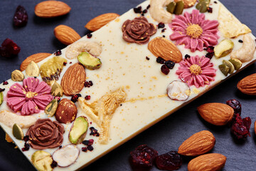 Handmade white chocolate with dried fruits and nuts