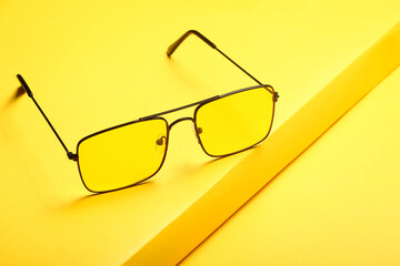glasses on a yellow background