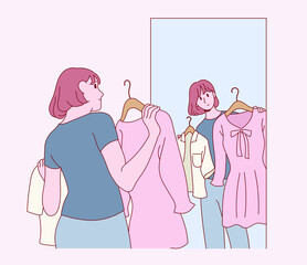 A woman is holding a dress and looking in the mirror. hand drawn style vector design illustrations. 
