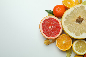 Ripe citrus on white background, space for text