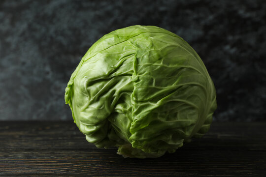 Fresh green cabbage on wooden table, close up