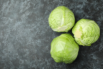 Fresh green cabbage on black smoky background