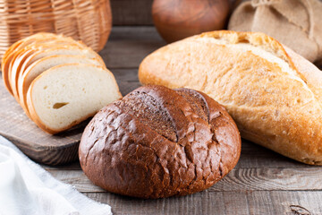 Assortment of baked bread on wooden table