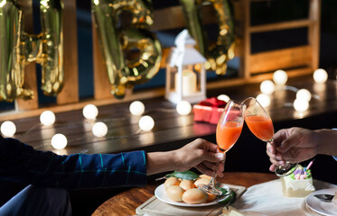 Happy gay couple have a romantic on birthday at home with simple dinner