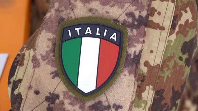 Europe, Italy , Milan March 2021 - 
vaccination with Astazeneca vaccine against Covid-19 Coronavirus continues - italian flag stamp on military uniform of the  army