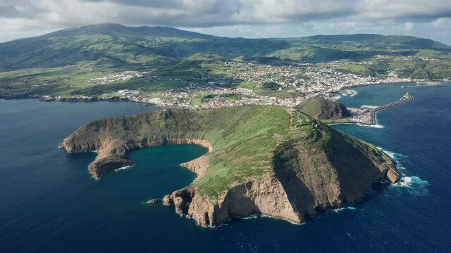 Monte de Guia, Horta, Azores, Portugal. Aerial footage over a volcanic cone with a great view over the bay of Horta city. A special protection area within the Atlantic. High quality 4k footage