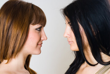 Two beautiful women posing together