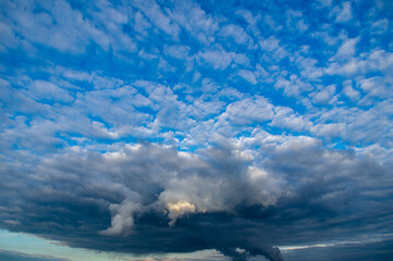 Cumulus clouds in a blue sky.