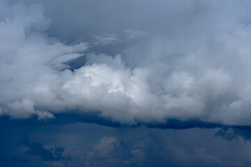 Cumulus clouds in a blue sky.