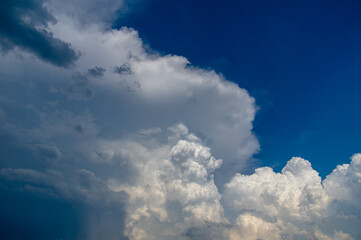 Cumulus clouds in a blue sky.