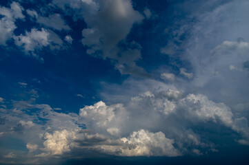 Naklejka na ściany i meble Cumulus clouds in a blue sky.