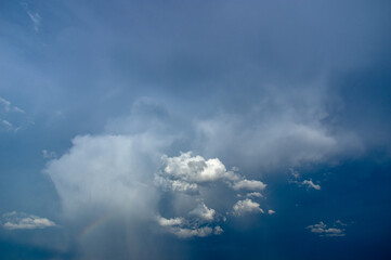Naklejka na ściany i meble Cumulus clouds in a blue sky.