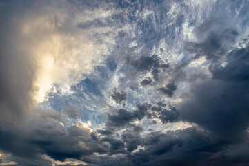 Cumulus clouds in a blue sky.