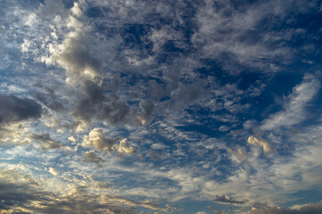 Cumulus clouds in a blue sky.