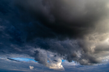 Cumulus clouds in a blue sky.