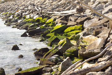 Rocks and breakwater in the blue Mediterranean Sea