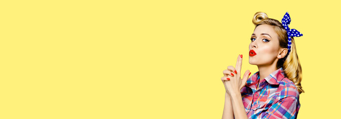 Pin up girl. Portrait of blond beautiful woman showing hand sign gesture. Retro and vintage...
