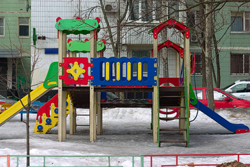 colorful slides on the children's playground near the house