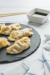 Meat gyozas with soy sauce