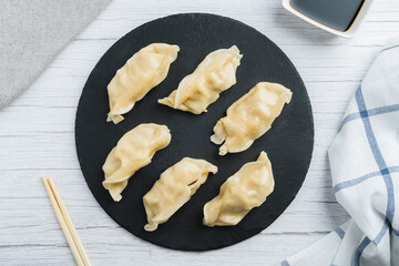Overview of meat gyozas with soy sauce