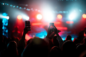 Photo of many people enjoying rock concert in nightclub