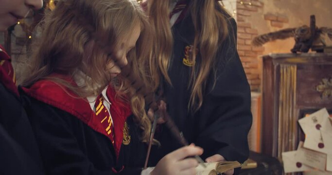 Three students of a wizard school are studying a magic book, 4k