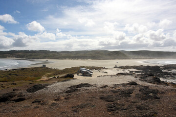 Beautiful ocean rocky coastline, clouds on the blue sky, no people