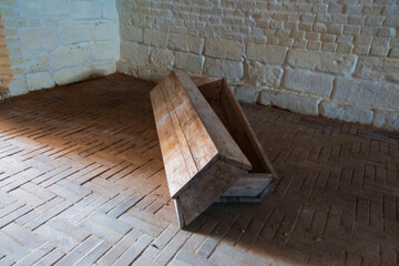 monastery dungeons with wooden coffins