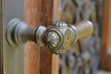 Old brass ornamental door handle 