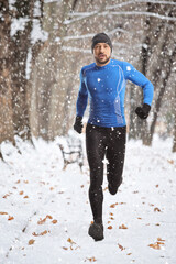 Full length portrait of a fit young man running outdoors