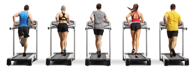 Rear view shot of people running on treadmills in a row
