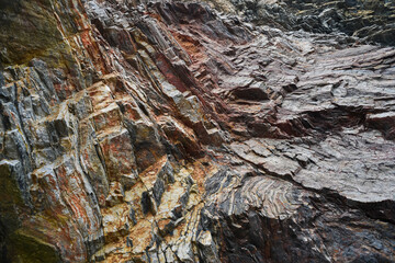 .Colorful rock rock texture, geological phenomenon in the rocks above the atlantic ocean.