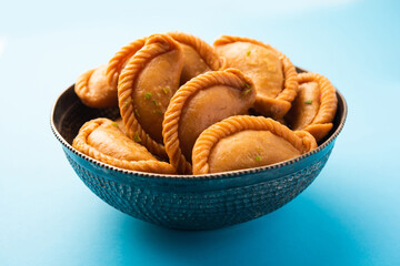 Indian Hili festival sweet Gujiya or Gujia or karanji in a plate